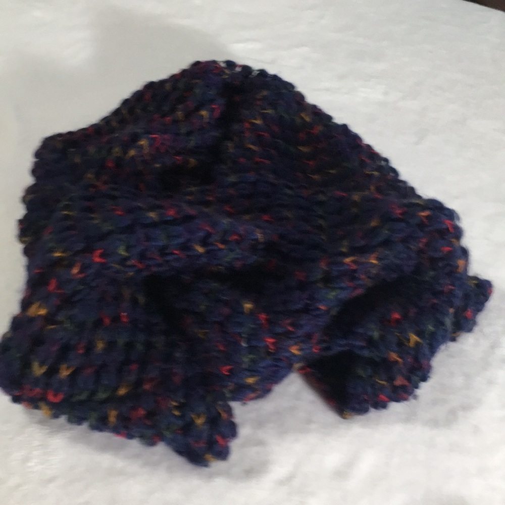 Blue knitted look infinity scarf with touches of red green gold